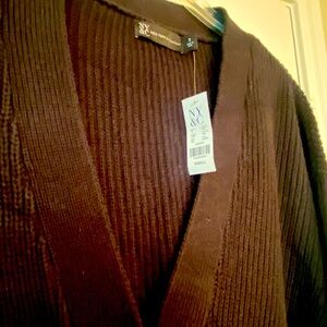 New with tags. Oversized black button up sweater.